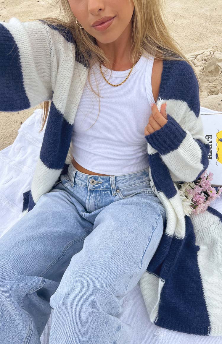 Close-up of the blue and white striped knit cardigan, showing the soft texture and relaxed open fit