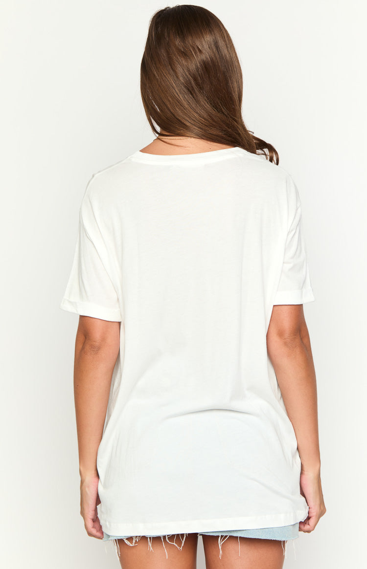 Rear view of a white oversized tee, showing the relaxed fit, crew neck, and cuffed short sleeves