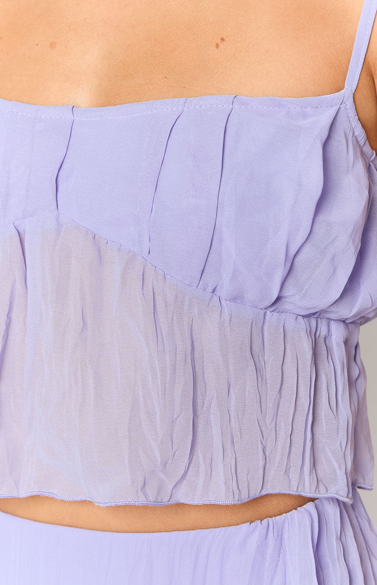Close-up of the lavender cami top's pleated bodice and crinkled sheer fabric with a diagonal seam