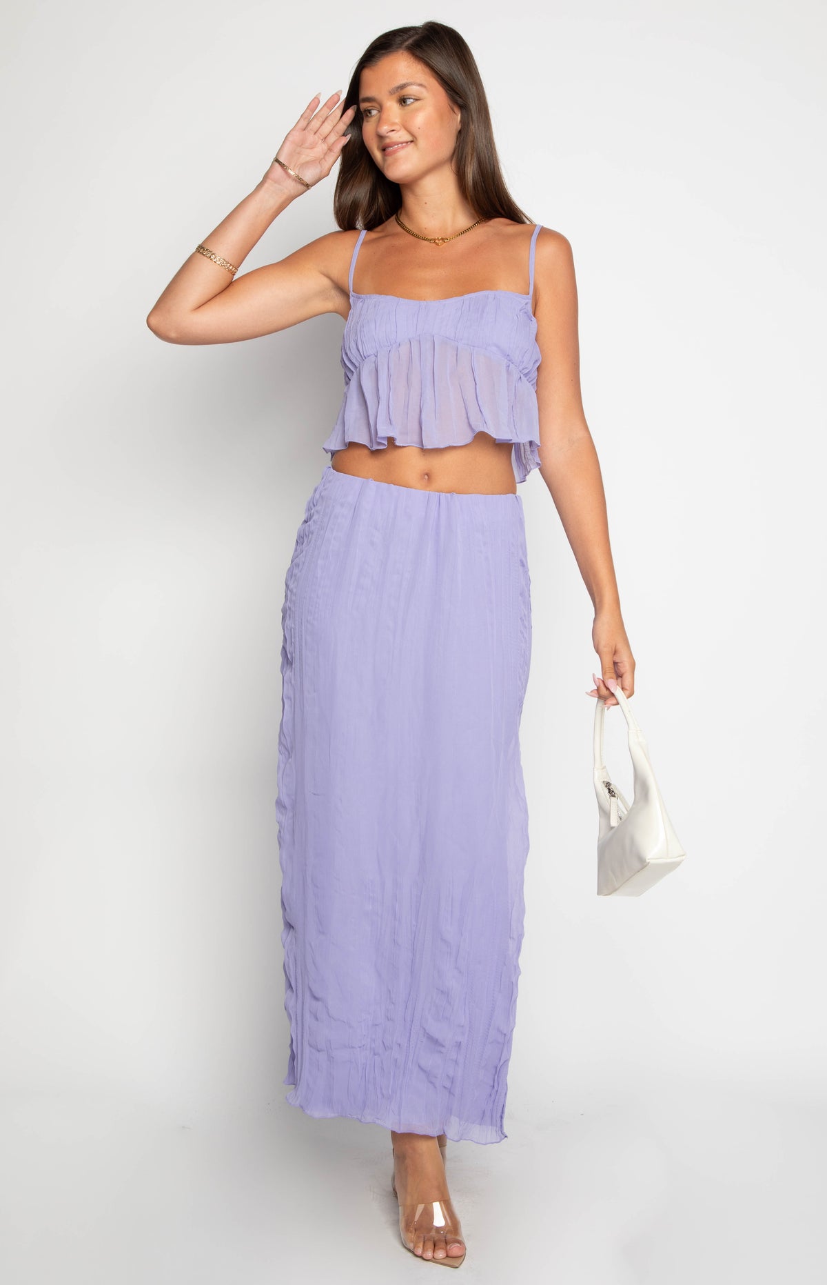 Purple cropped cami top with thin spaghetti straps, a square neckline, and a sheer ruffled overlay