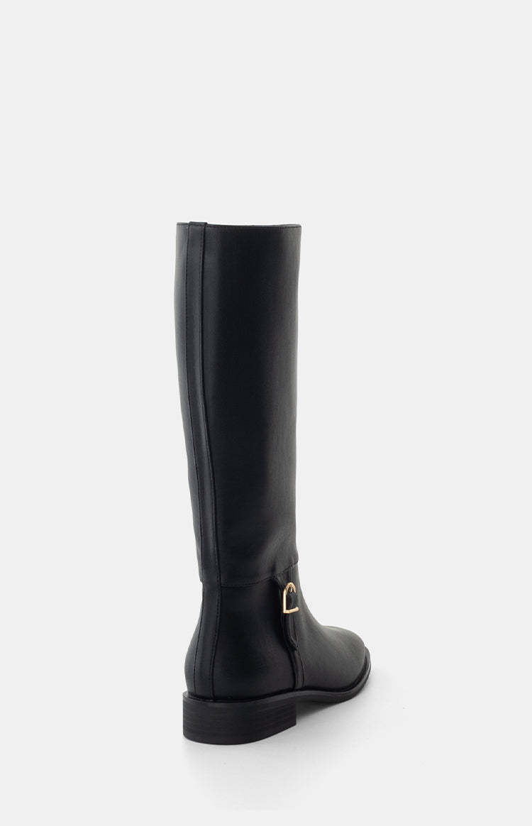 Side view of a black PU riding boot with a gold buckle detail on the ankle and a low block heel