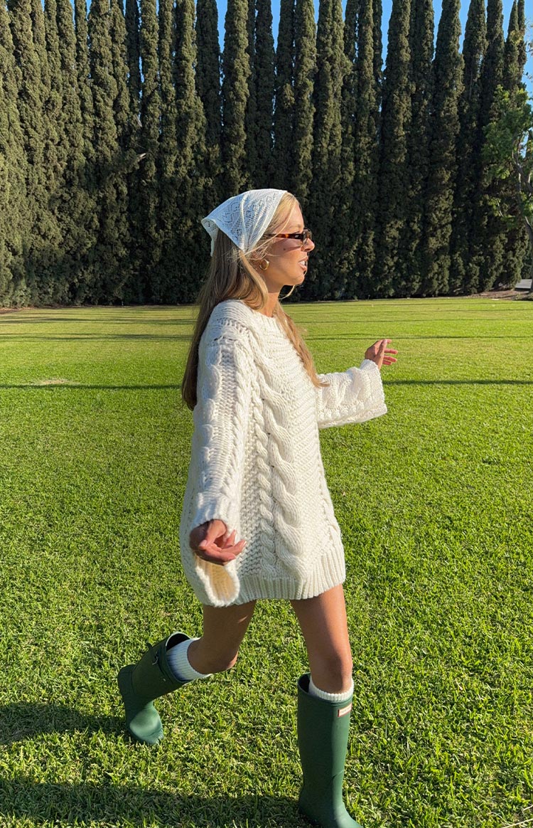 Beginning Boutique Thursdays Cream Cable Knit Sweater Dress cream cable knit oversized mini sweater dress with a round neck and long sleeves