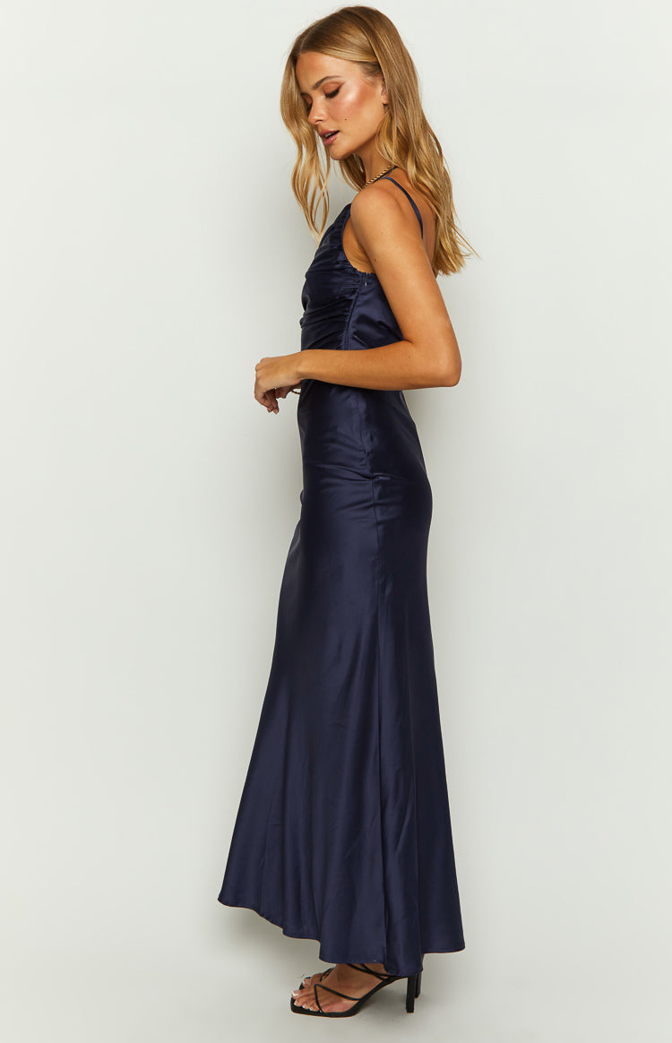 Side view of a navy satin maxi dress showing the ruched bodice and flowing skirt