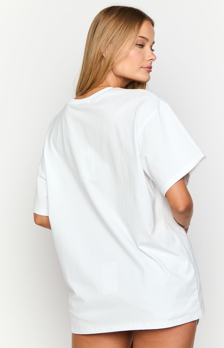 Rear view of a white oversized tee with a loose fit, wide short sleeves, and a straight hem
