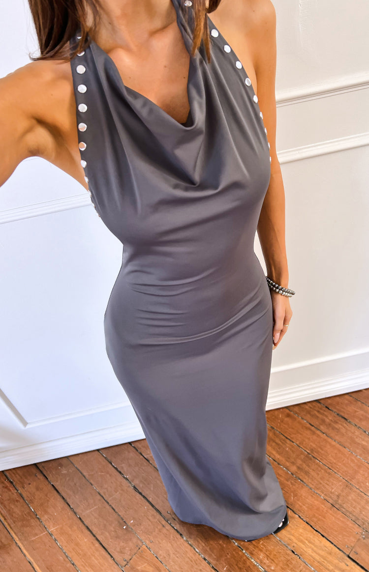 Fitted grey maxi dress with a draped cowl neckline and metallic stud details on the halter straps