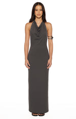Front view of a grey bodycon maxi dress with a cowl neck and silver stud details along the halter straps