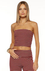Front view of a burgundy and white striped strapless tube top with a cropped hem