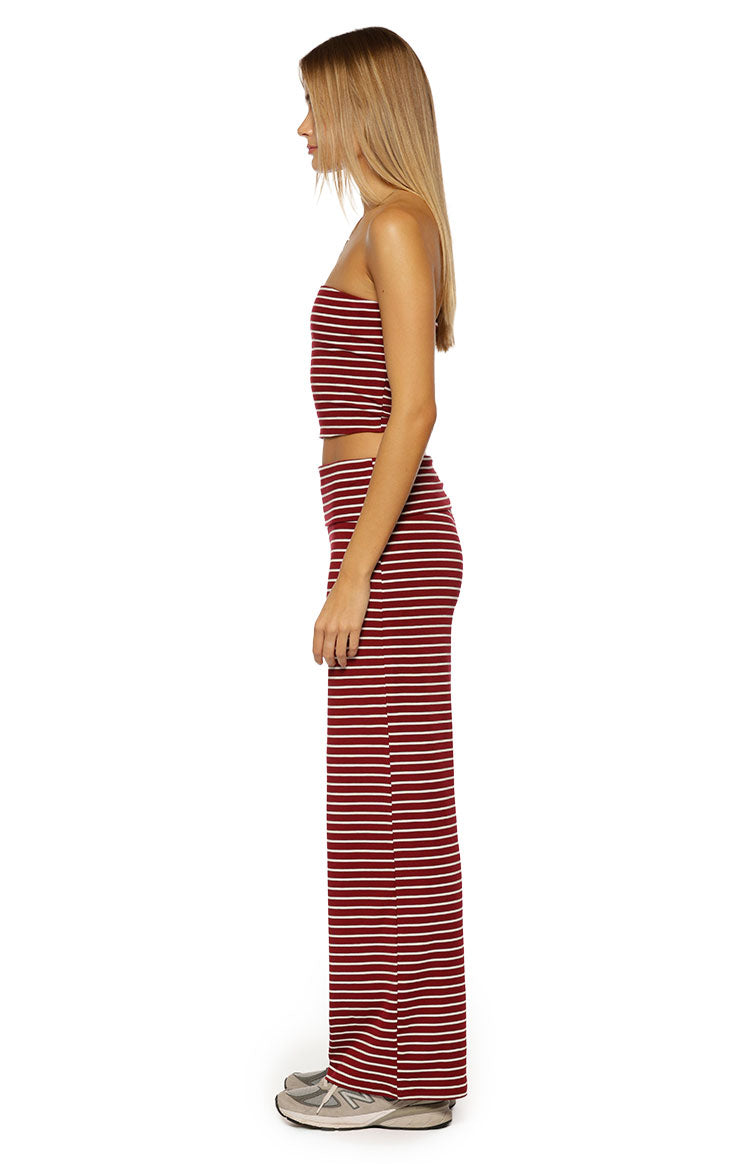 Side view of the cropped burgundy and white stripe strapless tube top with a fitted silhouette