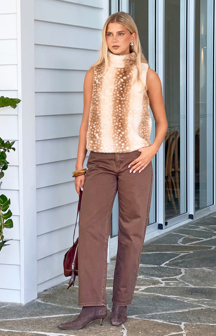 Full length view of brown carrot fit jeans with a relaxed leg and tapered ankle
