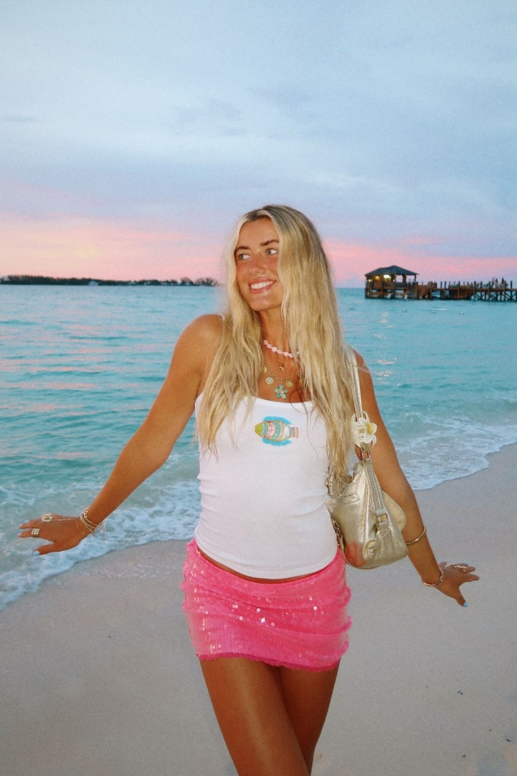 Bright pink sequin mini skirt with a gathered, layered design and a short hem