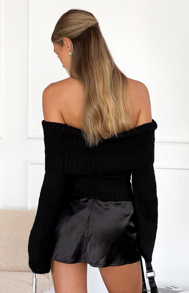 Smooth black satin mini skirt with a subtle sheen and simple A-line cut