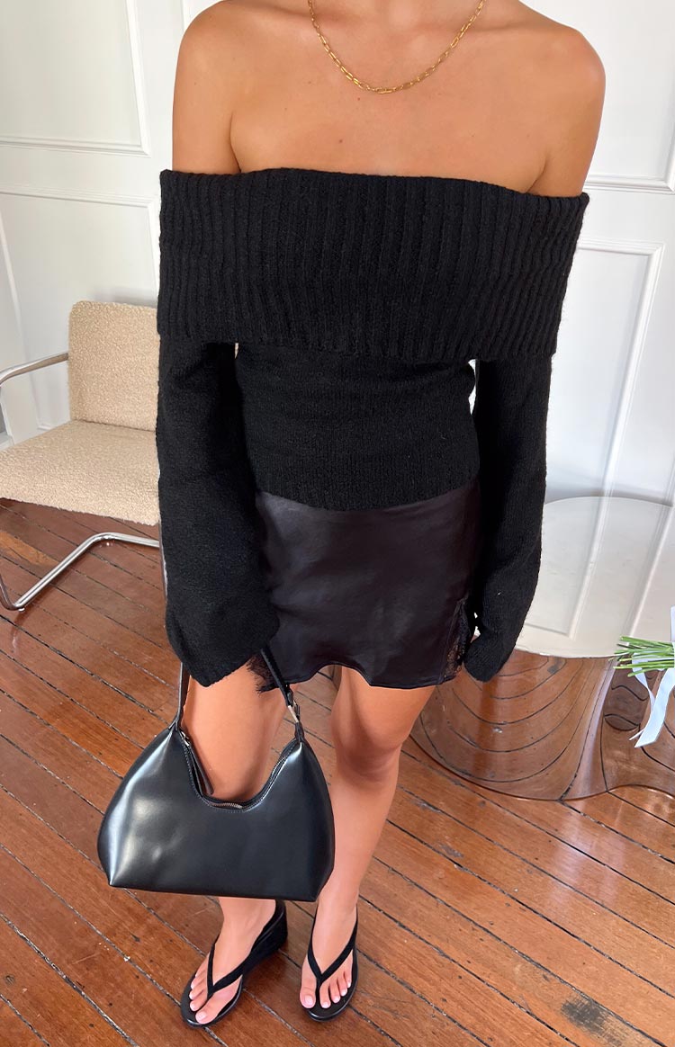 Black satin mini skirt with a lace trim on the side split