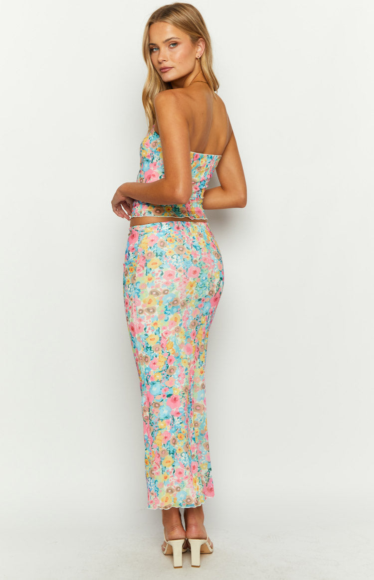 Side view of the multi floral maxi skirt, showing its fitted silhouette and vibrant all-over floral print