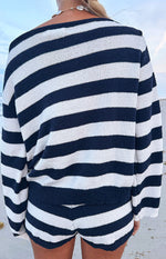 Rear view of the navy and white striped knit sweater, showing the wide boat neckline, long sleeves, and textured knit