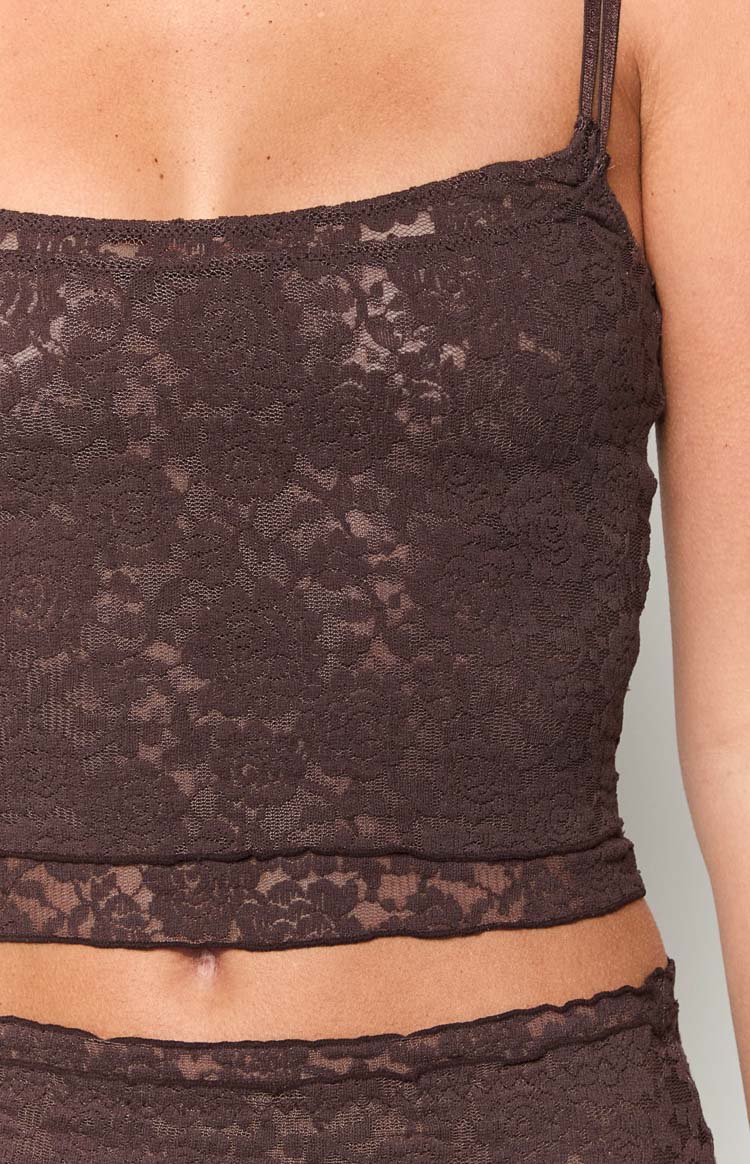 Close-up of the brown floral lace tank top showing the sheer fabric and cropped hem