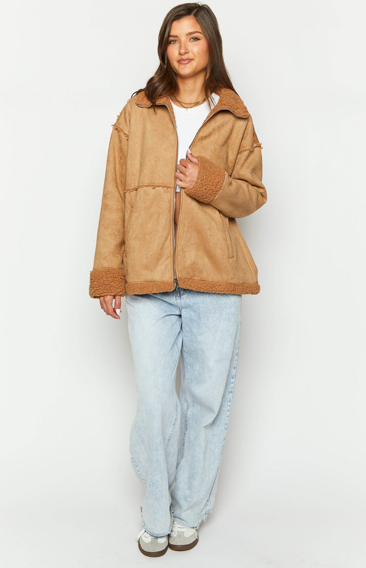Front view of a brown suede fur jacket with a relaxed fit, showing the full zip and fur collar and cuffs
