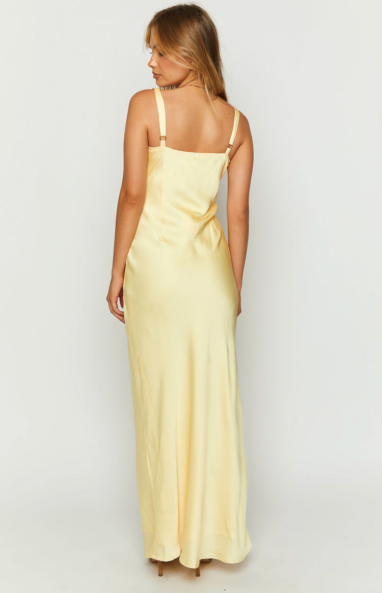 Rear view of a yellow satin maxi dress with a straight back and adjustable spaghetti straps