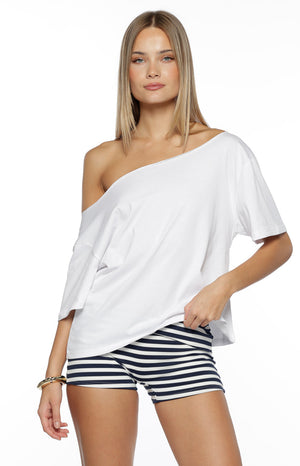 Our model wearing tight-fitting boy shorts in a bold navy blue and white horizontal nautical stripe pattern. This shorts are made of a knit fabric and have a thick waistband.