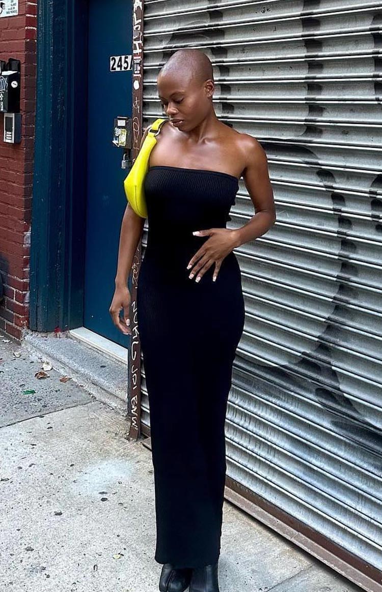 Black strapless ribbed knit maxi dress with a bodycon fit and straight hemline