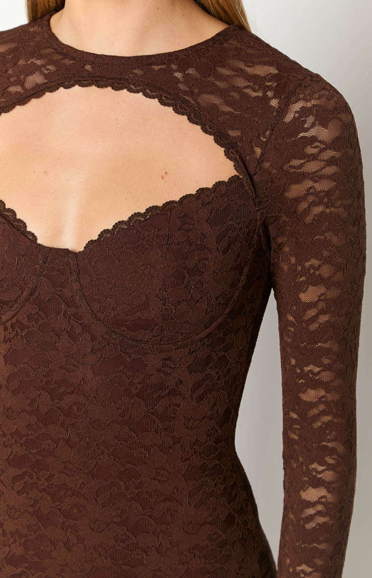 Close-up of the brown lace maxi dress bodice with a chest cutout, scalloped trim, sweetheart neckline, and long sleeves