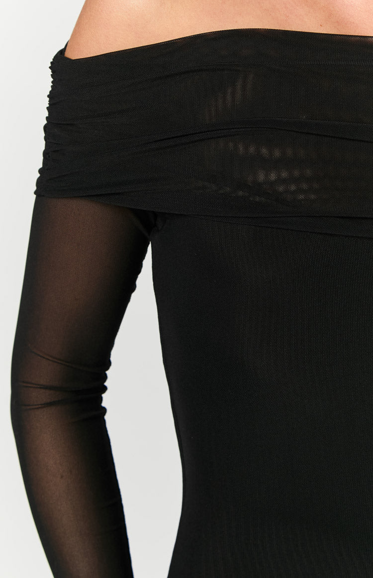 Close-up of the black off-shoulder neckline with ruched mesh detail and sheer long sleeve of a maxi dress
