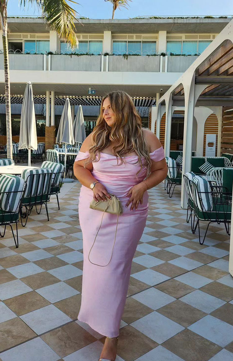 Light pink off-shoulder maxi dress with a ruched sweetheart neckline and fitted silhouette