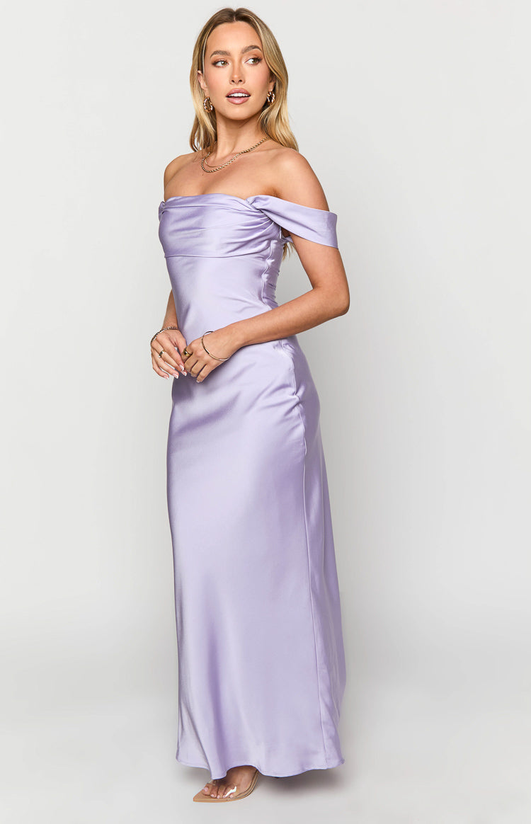 Side view of a lilac off-shoulder maxi dress with a draped neckline and flowing satin skirt