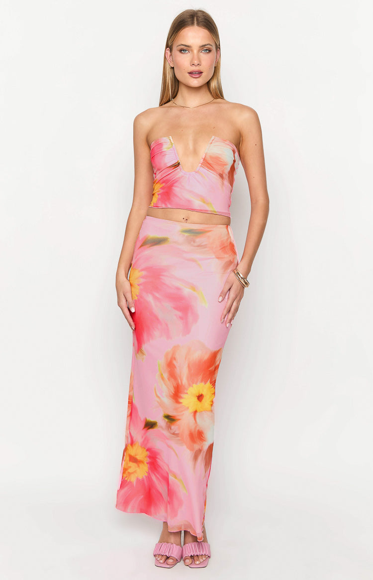 Front view of a pink floral maxi skirt with large orange and yellow abstract flowers