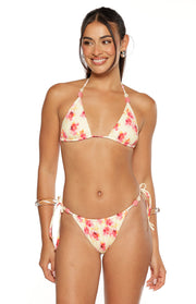 Front view of yellow and pink floral print bikini bottoms with ruched front and beaded tie sides