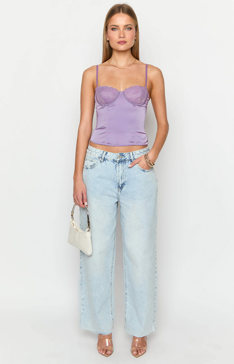 Front view of a cropped purple satin corset top with scalloped lace cups and thin straps