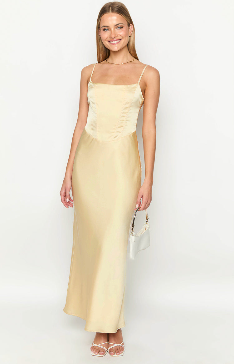 Front view of a light yellow satin maxi dress with a structured bodice and square neckline
