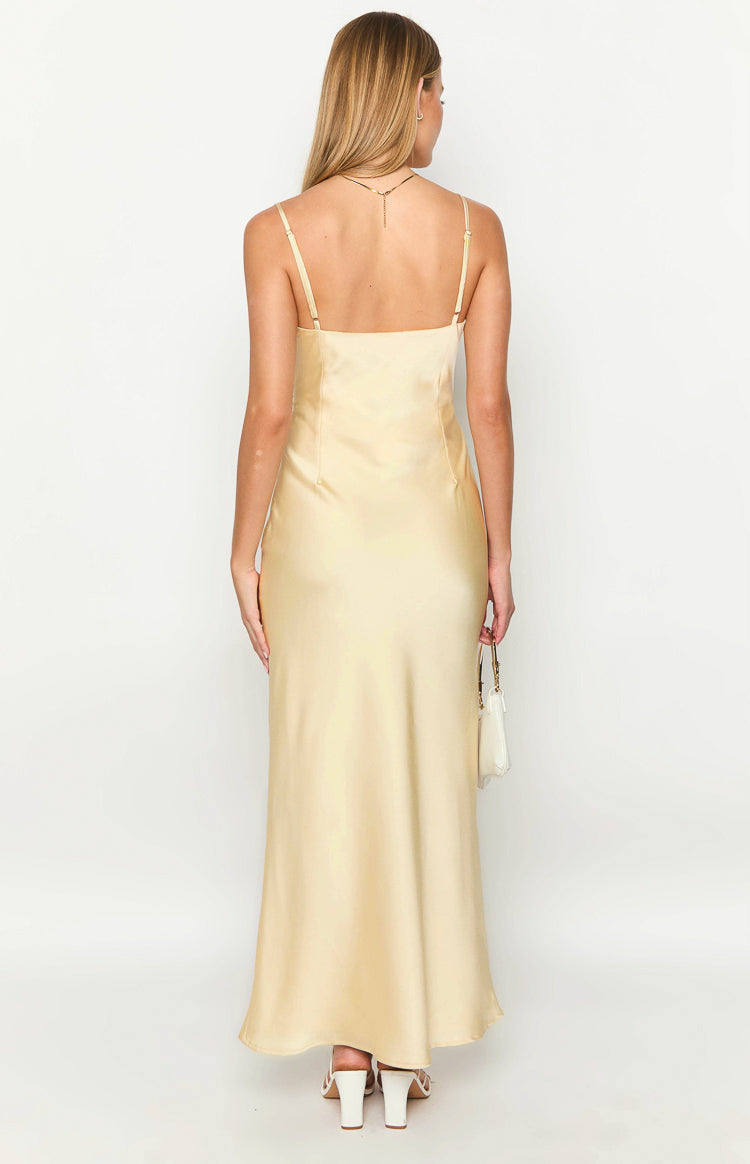 Rear view of a yellow satin maxi dress with thin adjustable spaghetti straps and a straight back