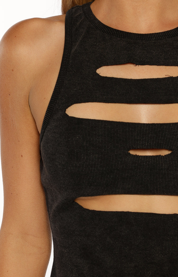 Close-up of the ribbed black wash tank top showing the horizontal cutouts and distressed fabric texture