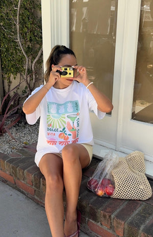 Beginning Boutique Jaz Dolce Vita Print Tee white oversized crew neck tee with a colourful fruit and cocktail graphic print