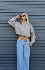 Cropped beige plaid funnel neck jacket with a relaxed fit, elasticated hem, and long sleeves with elasticated cuffs