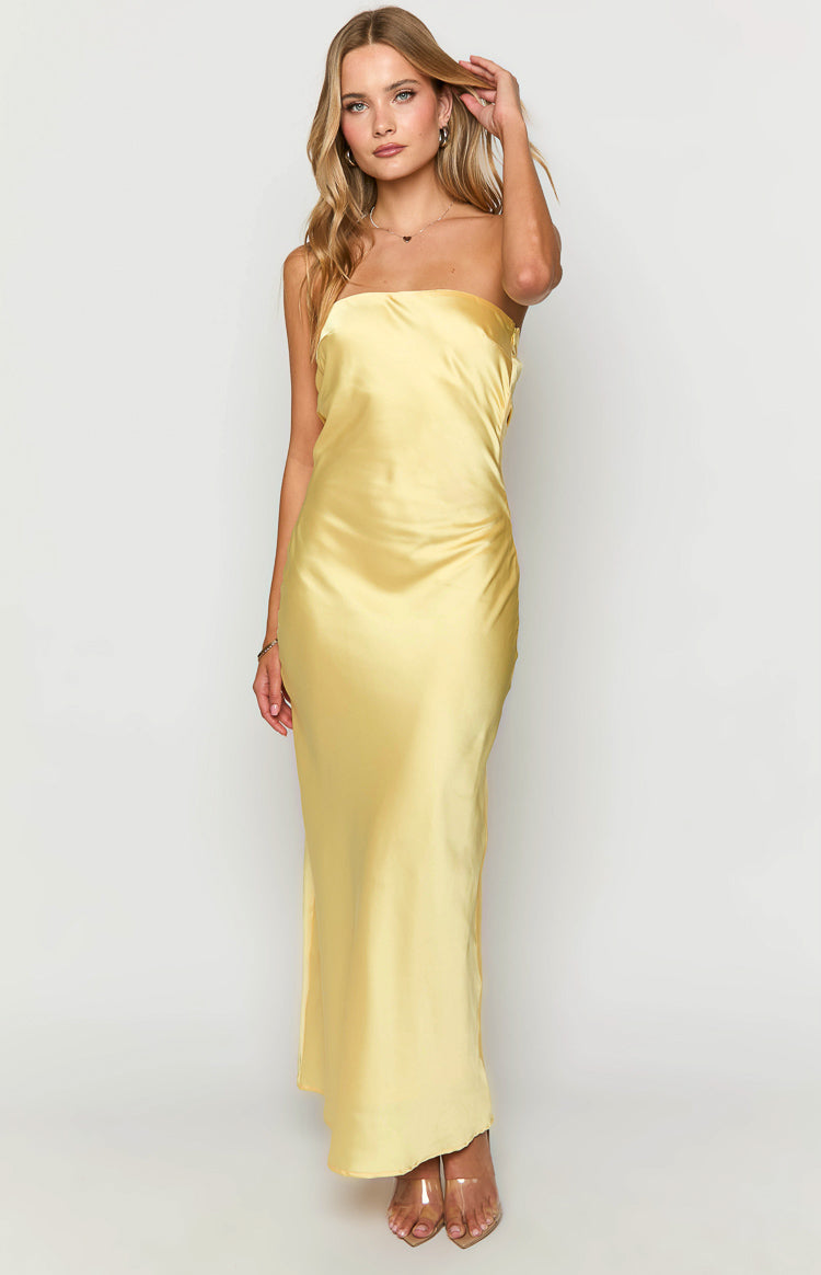 Front view of a yellow strapless maxi dress with a smooth satin finish and subtle side ruching