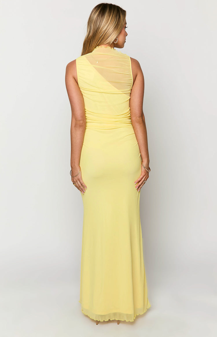 Rear view of the yellow maxi dress with a ruched mesh high neck and sheer back detail