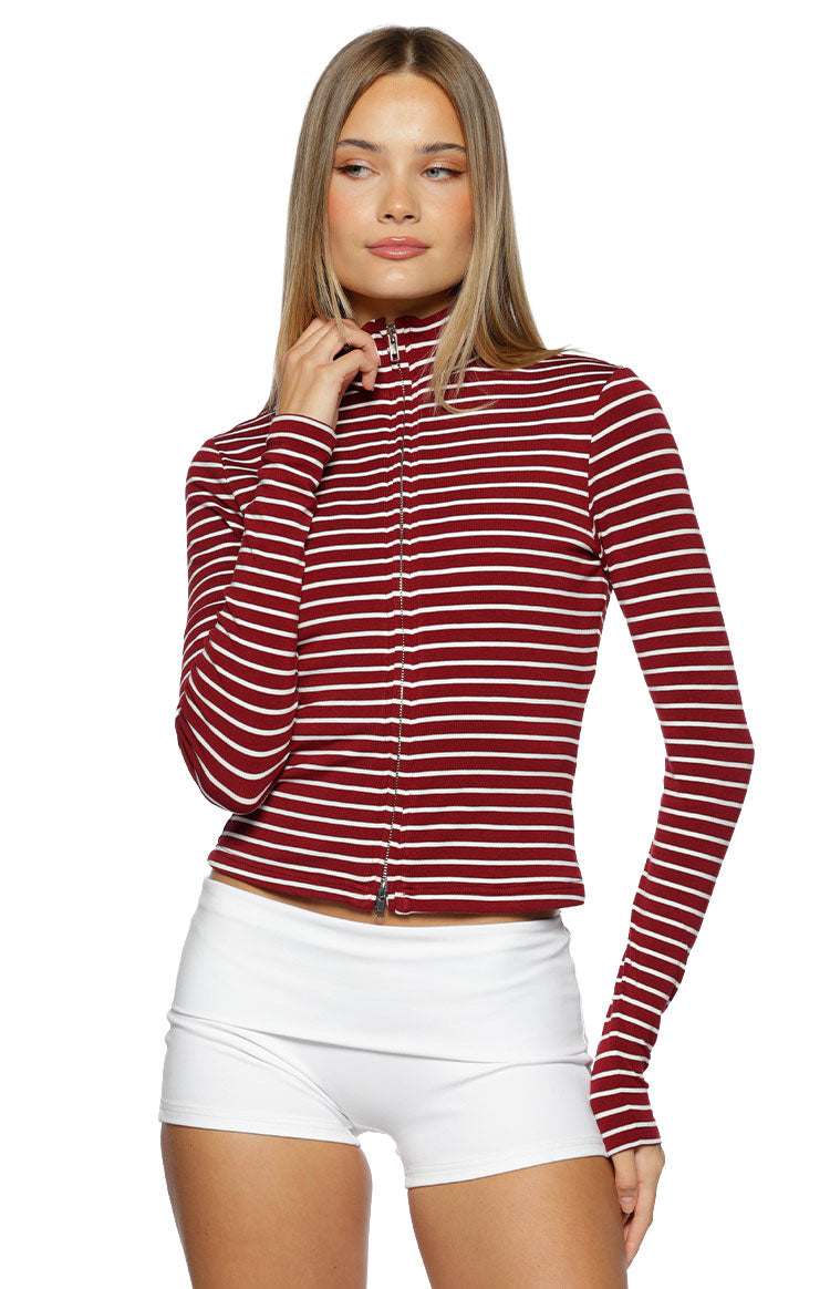 Front view of a burgundy and white striped ribbed knit sweater with a high neck and full-length double zipper