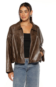 Front view of a brown PU bomber jacket, open to show the full zip and side pocket detail, with a bubble hem