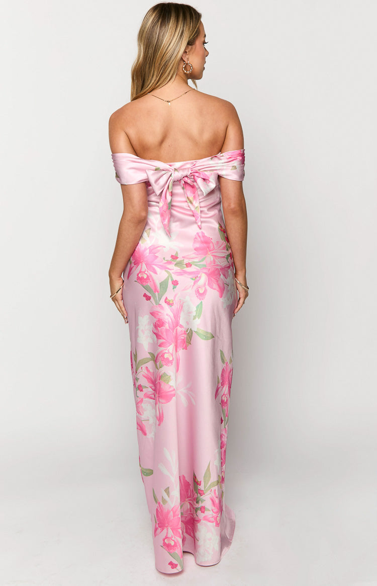Rear view of a pink floral off-the-shoulder maxi dress with a large bow tie at the back