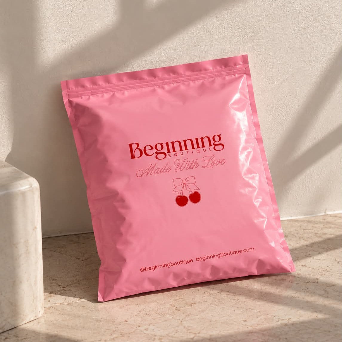 Beginning Boutique pink compostable mail bag - eco friendly packaging option.