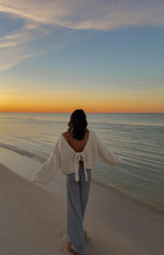 Beginning Boutique Holiday Cream Tie Up Knit Cardigan cream chunky knit tie-up back cropped cardigan with long sleeves