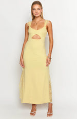 Yellow maxi dress with lace shoulder straps, a sweetheart neckline, waist cutout, and lace side panels