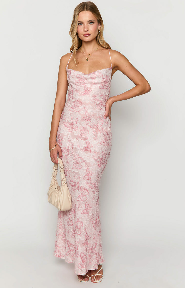 Pink maxi dress with an intricate white butterfly lace overlay, cowl neckline, and spaghetti straps