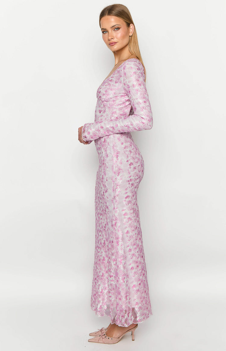 Side view of a pink floral lace long sleeve maxi dress with a V-neck, underbust seam, and fitted skirt