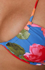 Close-up of the blue floral print bikini cup with ruched top edge and thin strap