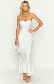 Front view of a white strapless satin maxi dress featuring a twisted detail on the bust