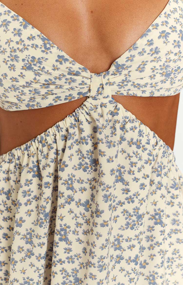 Cream floral mini dress with twisted bust detail and ruched elasticated waist cutouts