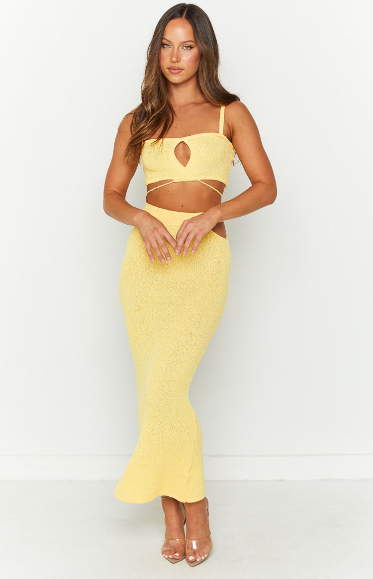 Yellow textured knit crop top with a front keyhole cutout, spaghetti straps, and long wrap-around waist ties