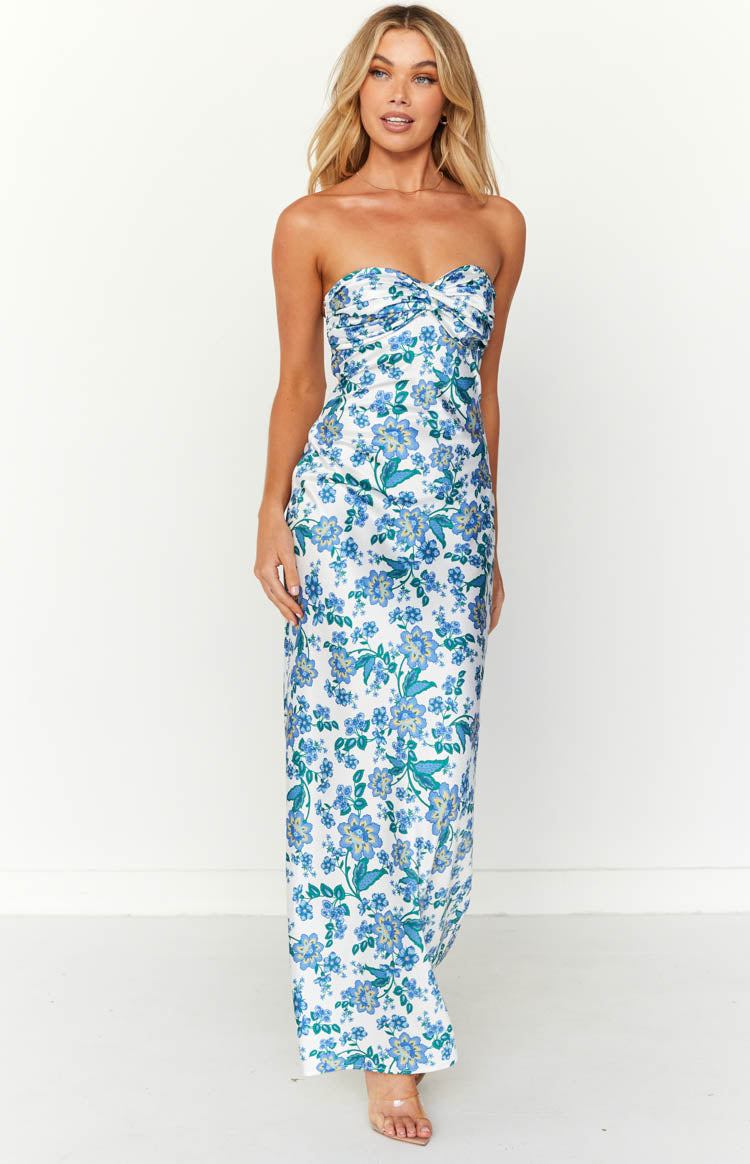 White strapless maxi dress with blue floral print and a ruched sweetheart neckline